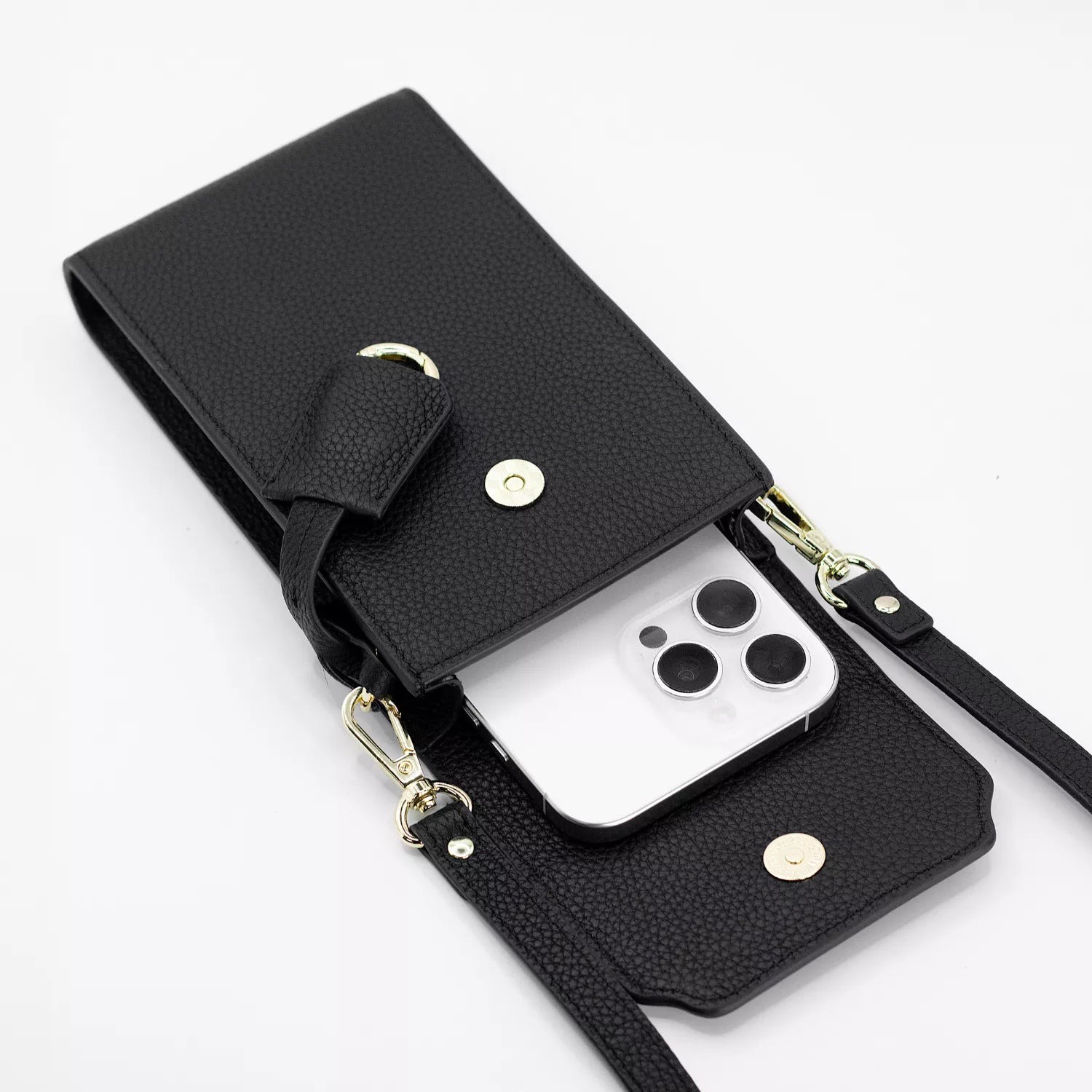 Boreal Bolso Cruzado Compacto en cuero Negro de Urzus, vista interior con celular — diseñado para llevar billetera y tarjetero con seguridad.